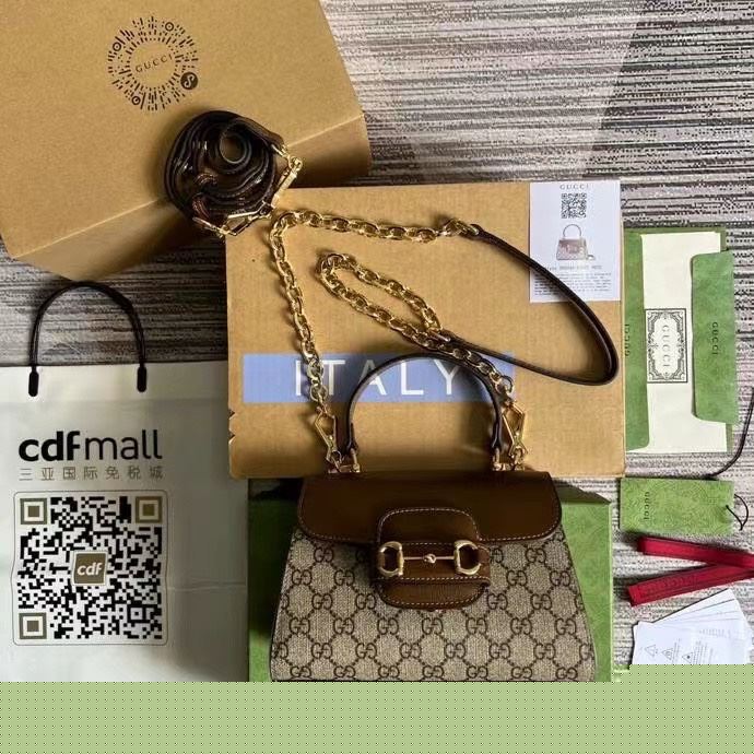 G*u*i top handle bags